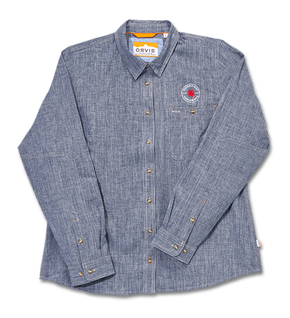 The Orvis  Women s Tech Chambray Blue Work Shirt Long Sleeve Knife shown opened and closed.